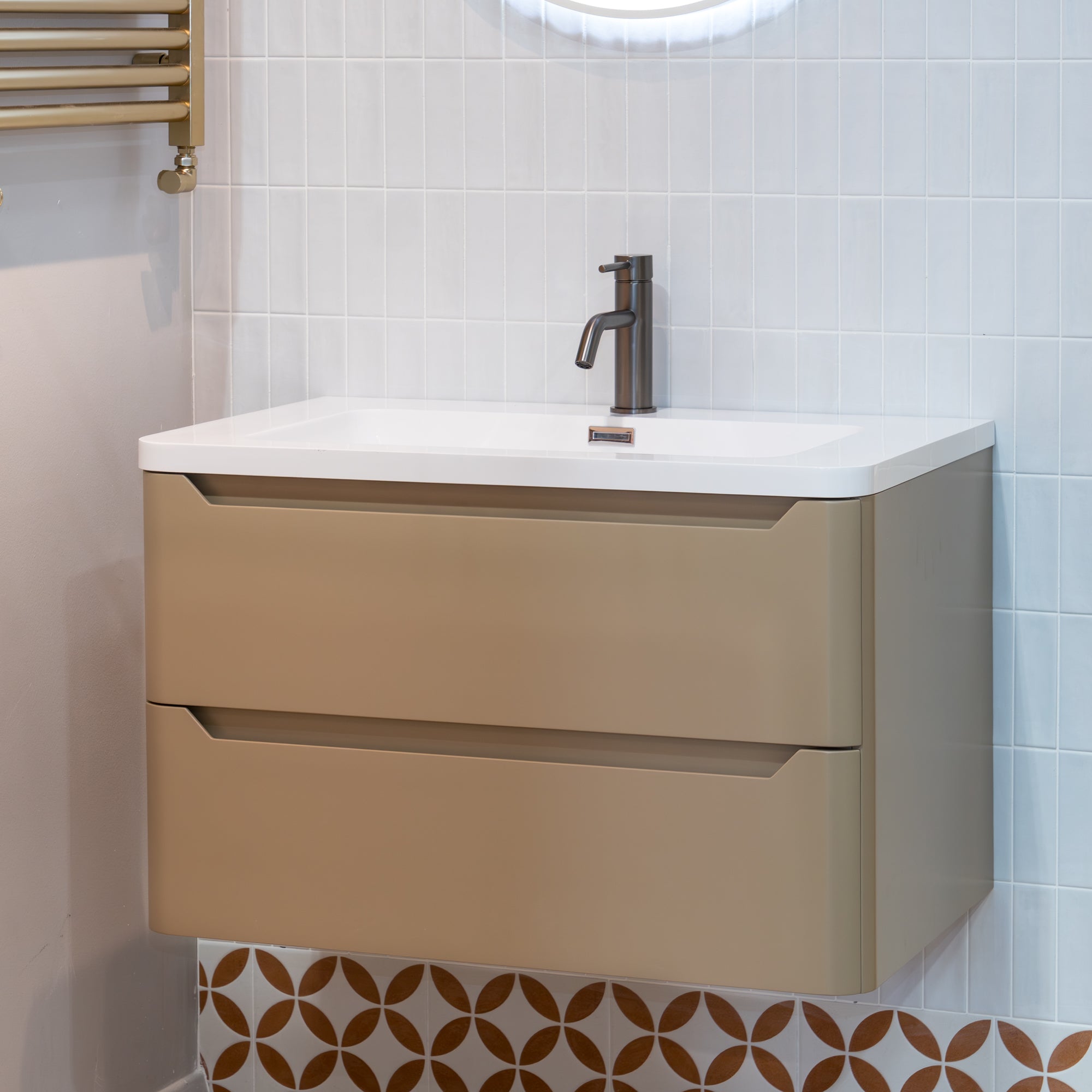 capuccino wall-mounted vanity with white countertop and gunmetal mixer in a bathroom setting.