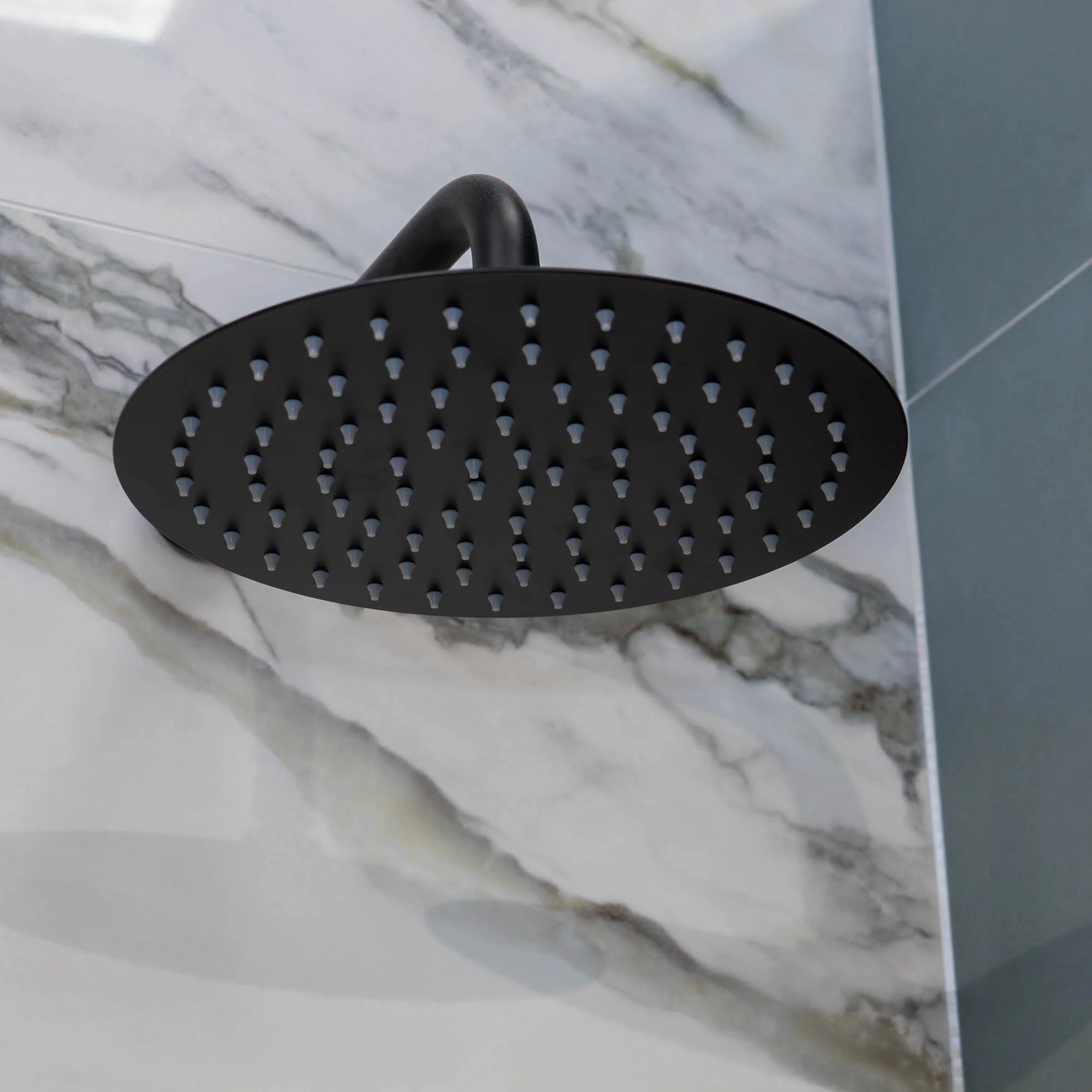 Portofino shower head on a marble wall deluxe bathrooms