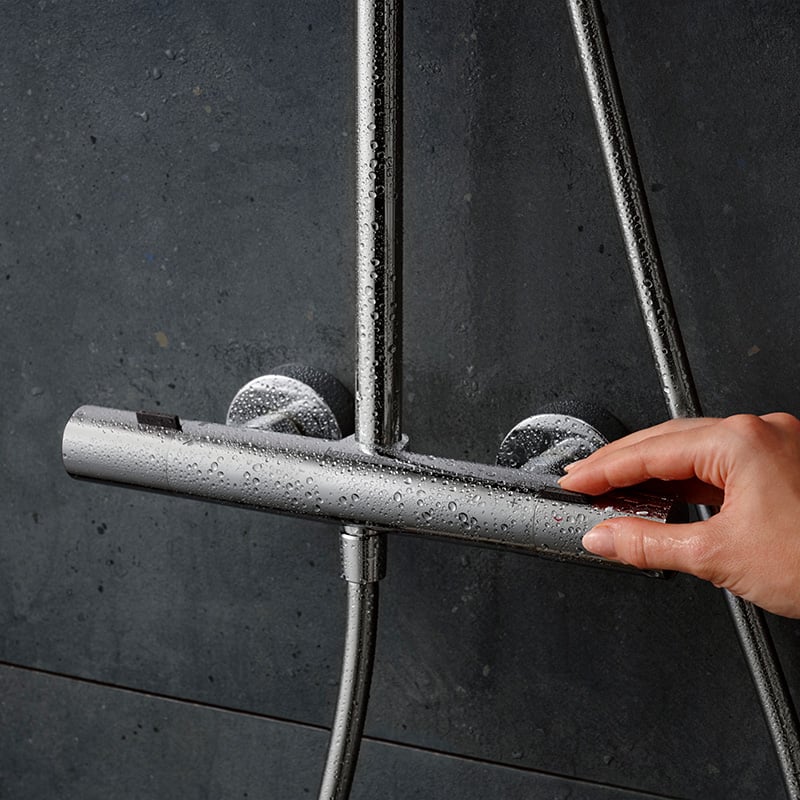 Wet Hansgrohe Pulsify S Puro shower system thermostat in chrome, supplied by Deluxe Bathrooms.