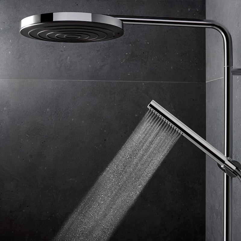 Water jet from handset shower of the Hansgrohe Pulsify S Puro shower system, in a chrome finish, supplied by Deluxe Bathrooms.