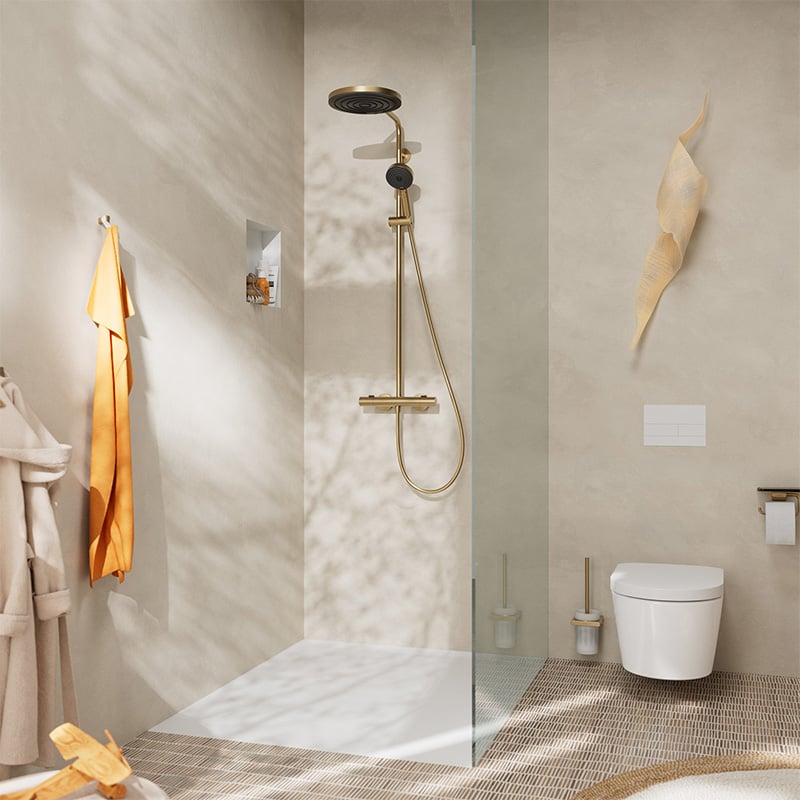 Lifestyle view of the Hansgrohe Pulsify S Puro Shower, in brushed bronze finish, supplied by Deluxe Bathrooms.
