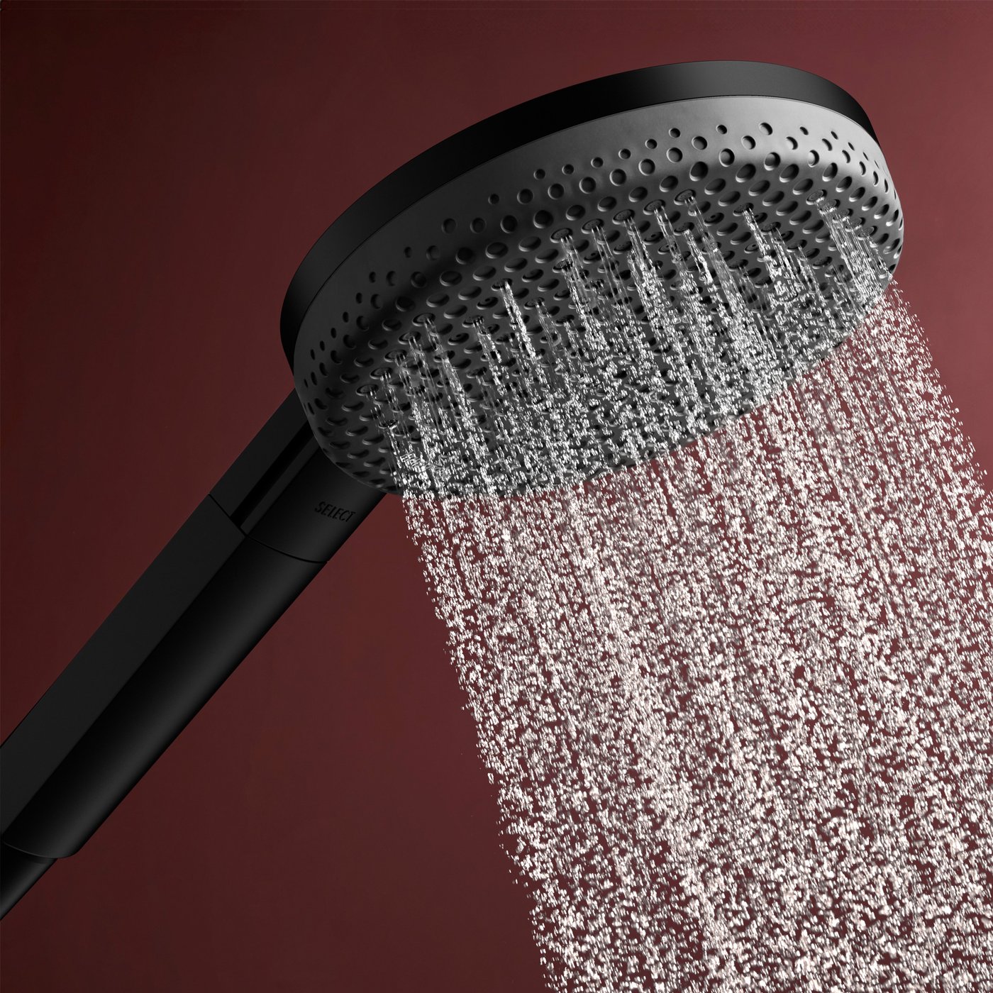 Close up view of the matt black shower head from the Hansgrohe Raindance Alive shower system, supplied by Deluxe Bathrooms.