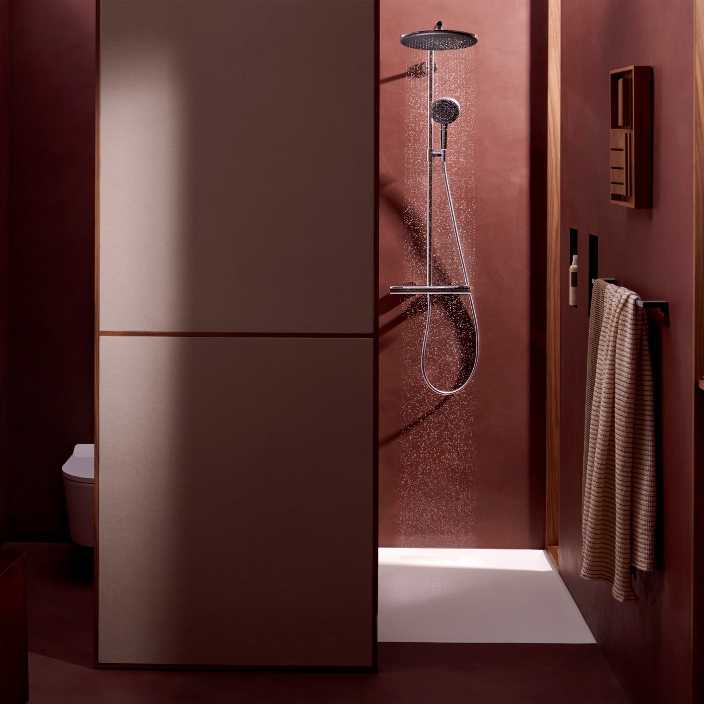 Lifestyle bathroom view of the Hansgrohe Raindance Alive shower system, in chrome, supplied by Deluxe Bathrooms.