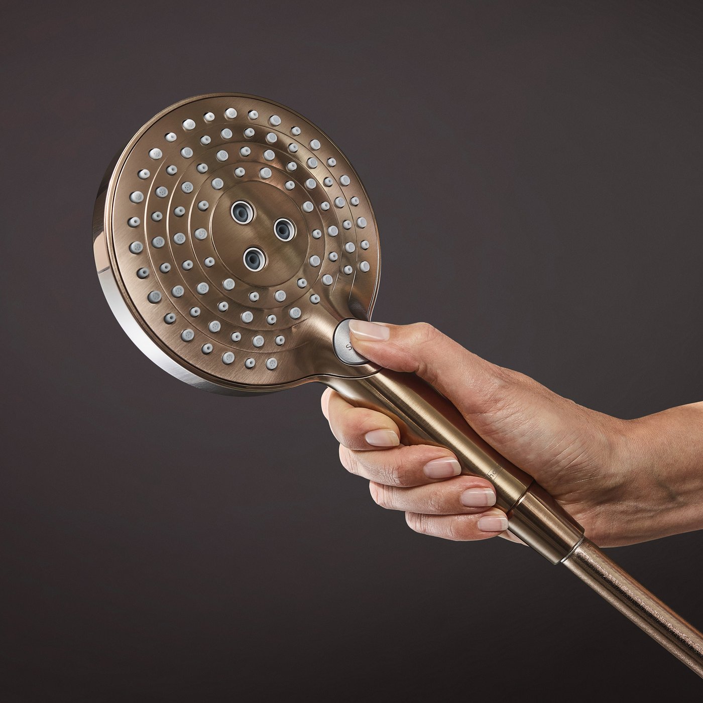 Handset shower water jet selection button on a Hansgrohe Shower supplied by Deluxe Bathrooms.