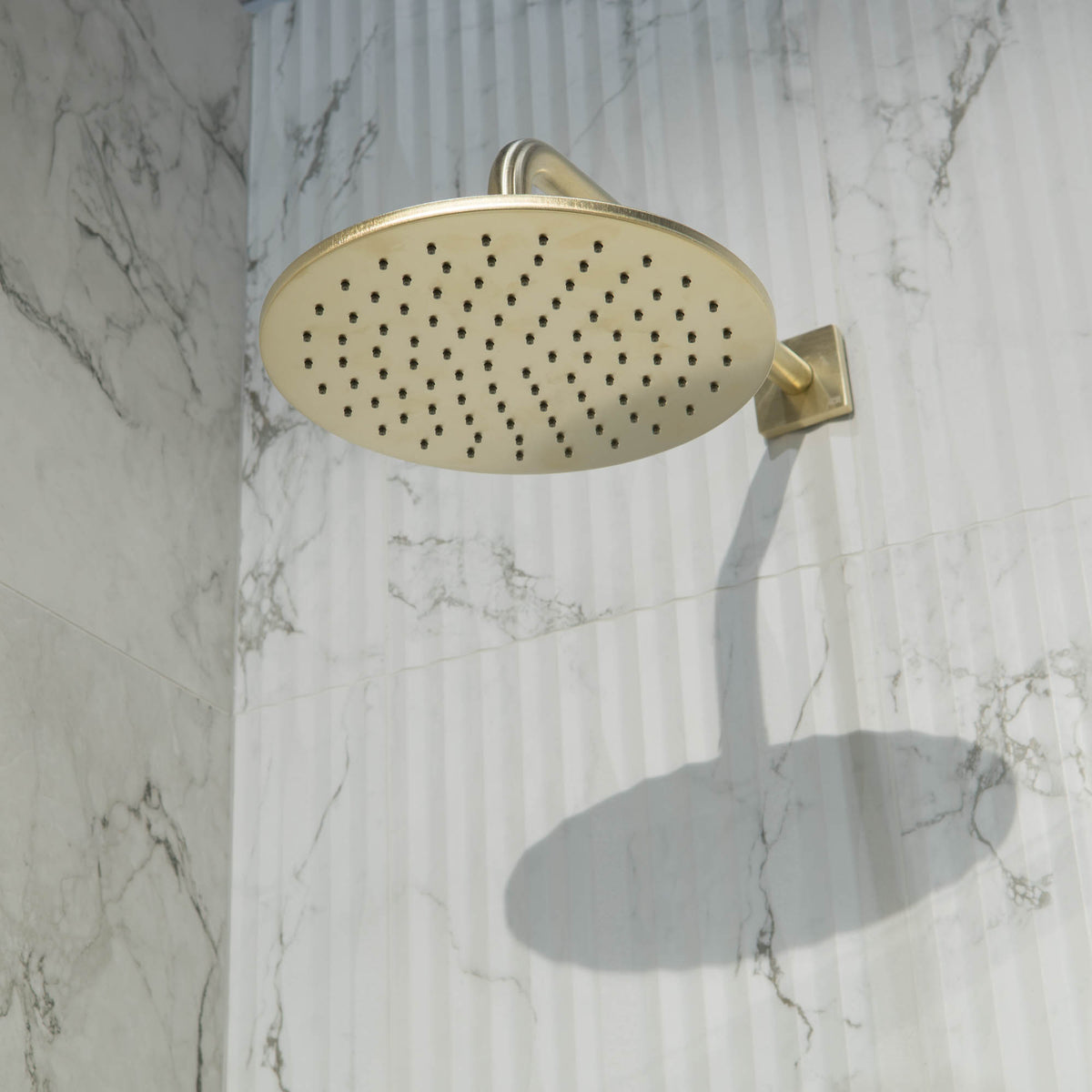 Shower Head in Brushed Brass Gold Finish Wall Mounted at Deluxe Bathrooms Showroom