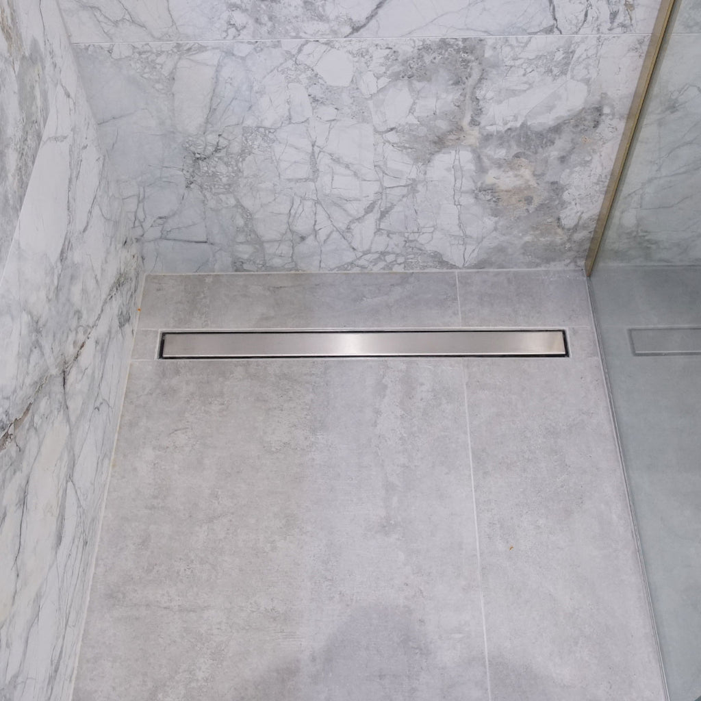 http://deluxebathrooms.ie/cdn/shop/products/linear-shower-drain-stainless-steel-grating_1024x.jpg?v=1698771983