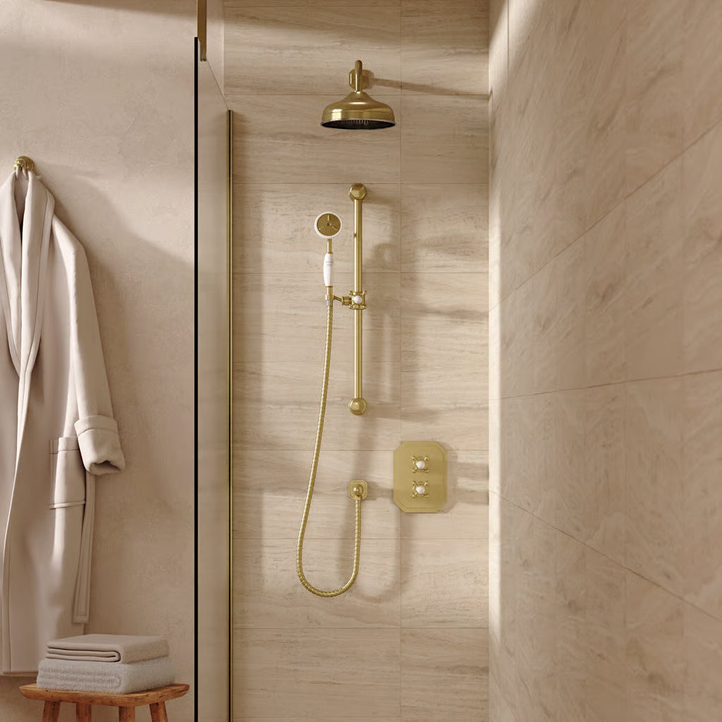 Lifestyle image of the Belgravia Shower Set Bundle in brushed-brass, featuring wall mounted shower head and slide rail for the handset, supplied by Deluxe Bathrooms Ireland.