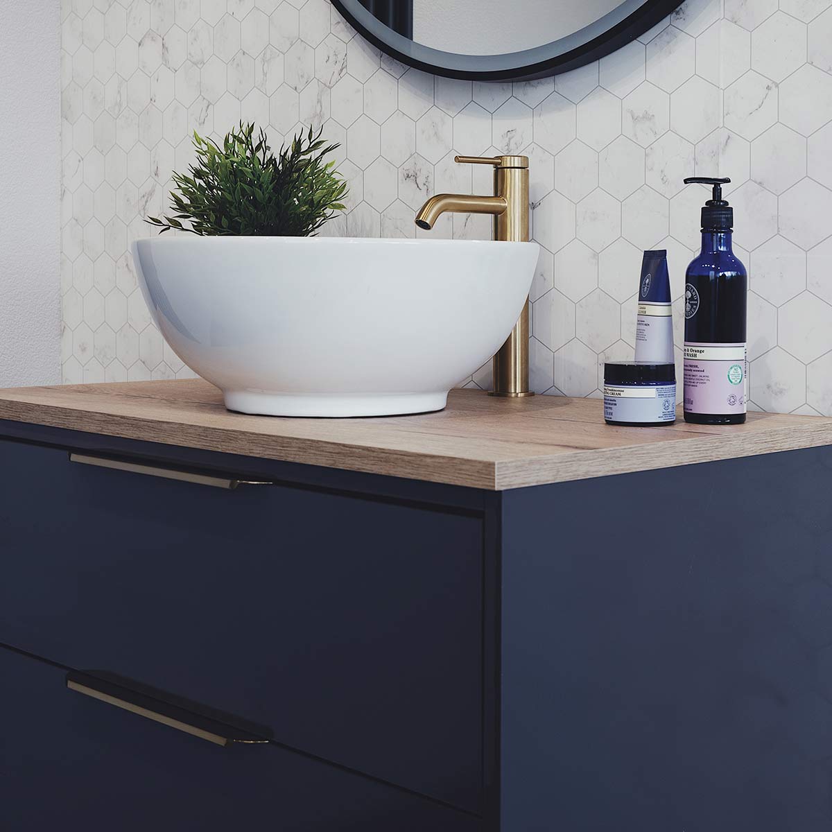 duo double drawer wall hung matt blue vanity unit with brushed brass handles windsor oak worktop white basin
