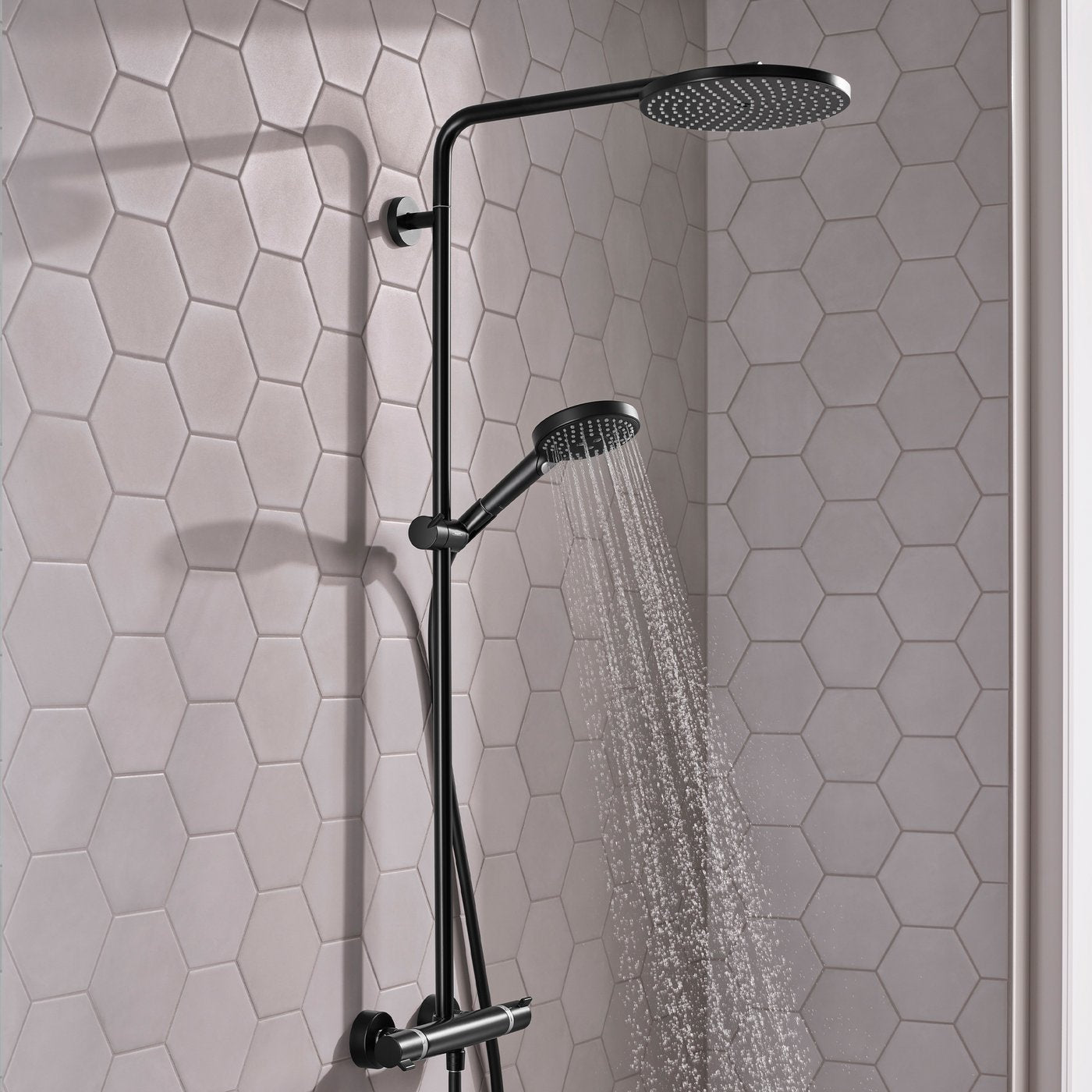 Even, soft spray of water from handset of Hansgrohe Raindance Select 1-Jet Shower system - in matt black finish, supplied by Deluxe Bathrooms.
