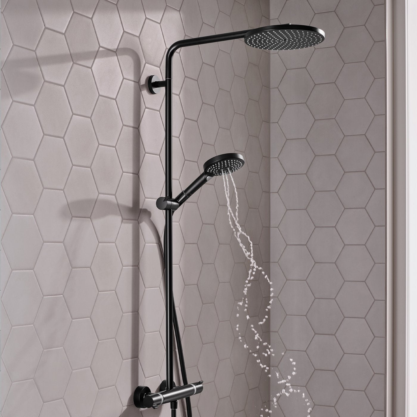 Water whirl flowing from handset of Hansgrohe Raindance Select 1-Jet Shower system - in matt black finish, supplied by Deluxe Bathrooms.