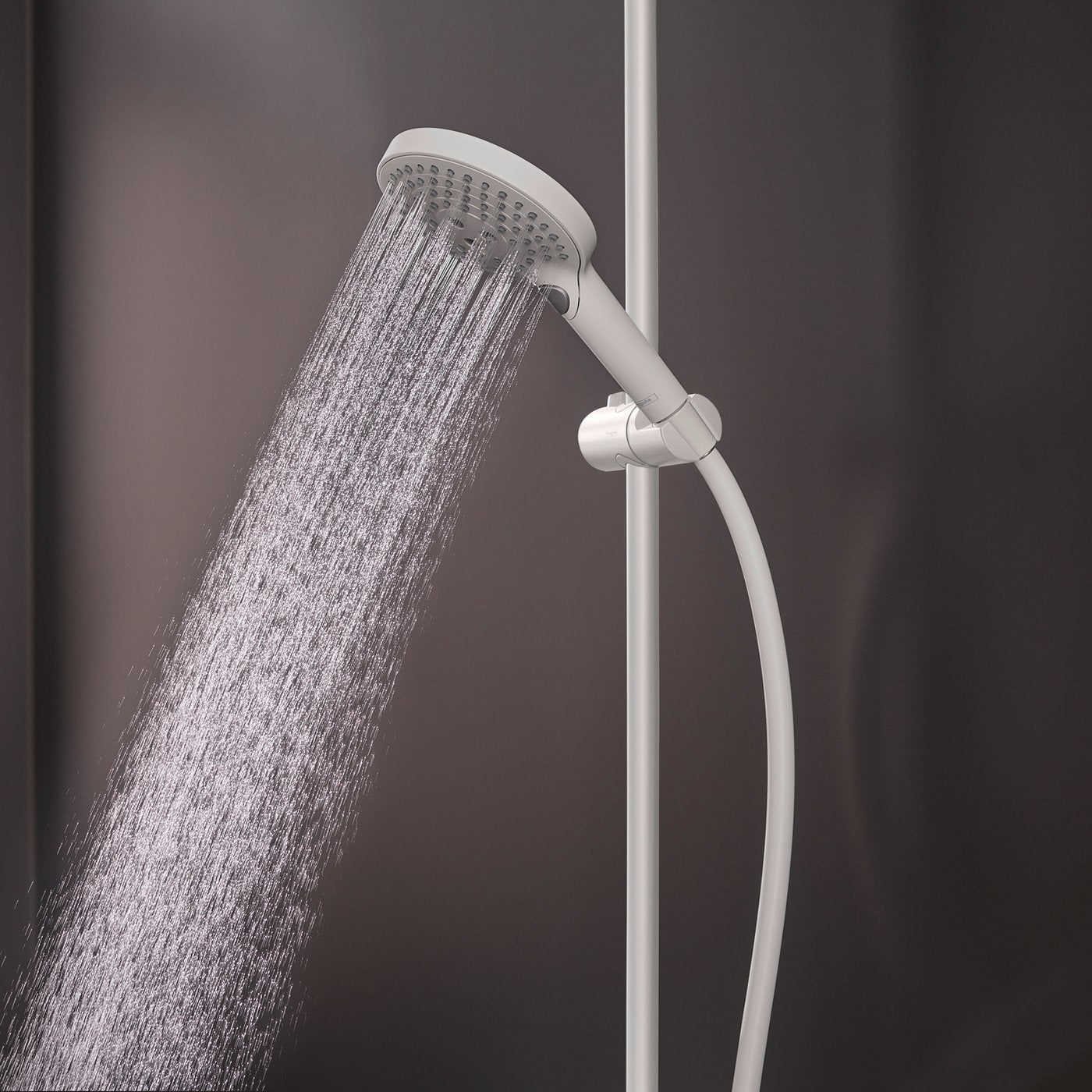 Extra fine, enveloping spray of water from handset of Hansgrohe Raindance Select 1-Jet Shower system - in matt white finish, supplied by Deluxe Bathrooms.
