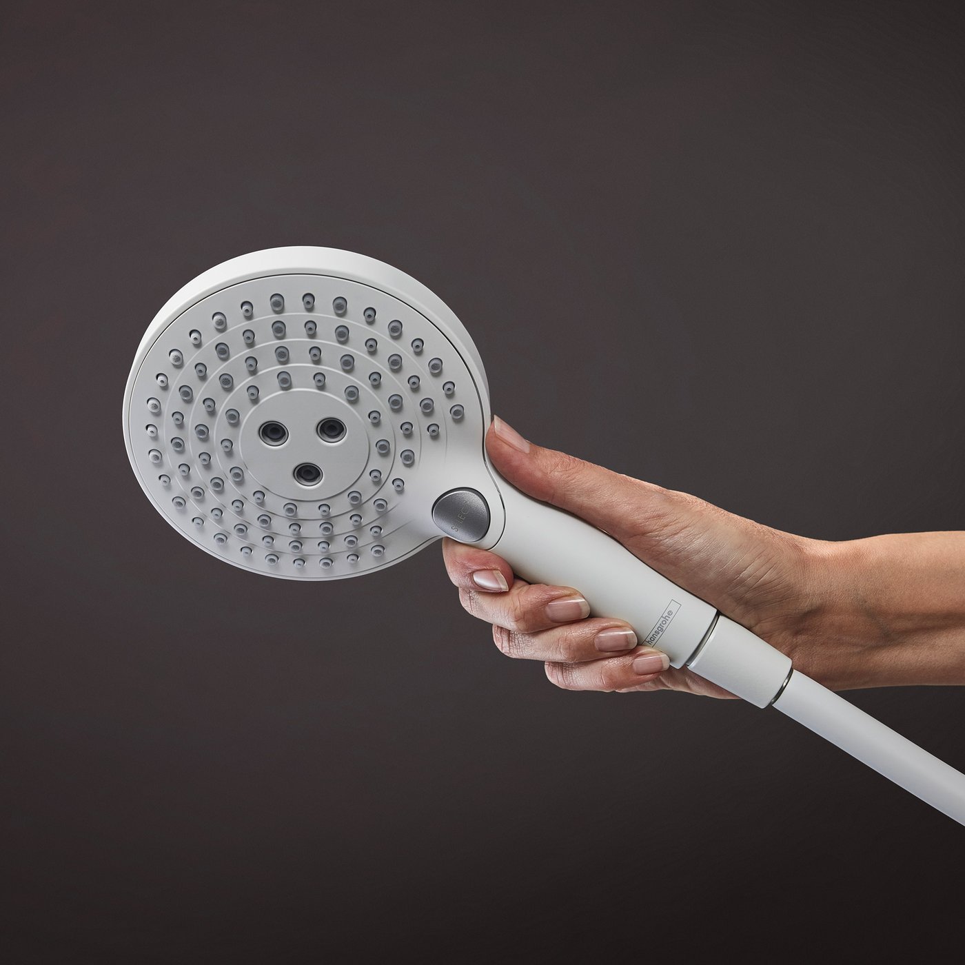 Handset shower water jet selection button on a Hansgrohe Shower supplied by Deluxe Bathrooms.