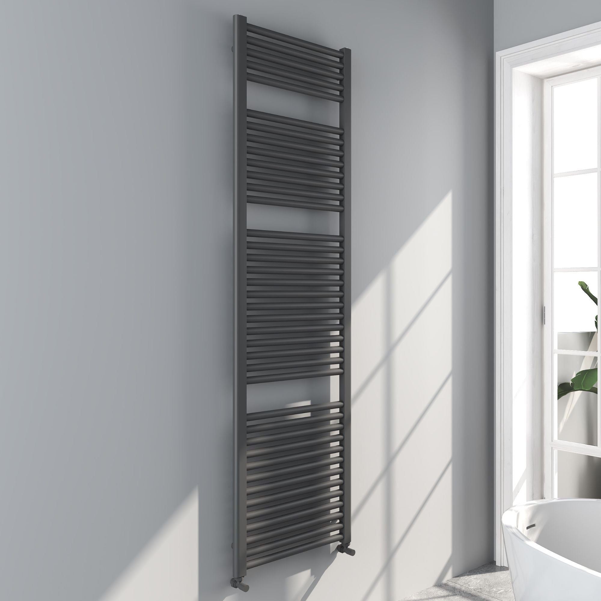 Soho gunmetal towel radiator 1800x500mm on a white wall with a window in the background deluxe bathrooms