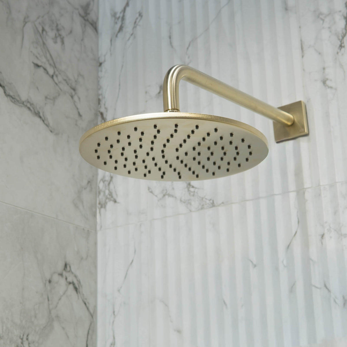 Shower Head in Brushed Brass Gold Finish Wall Mounted at Deluxe Bathrooms Showroom
