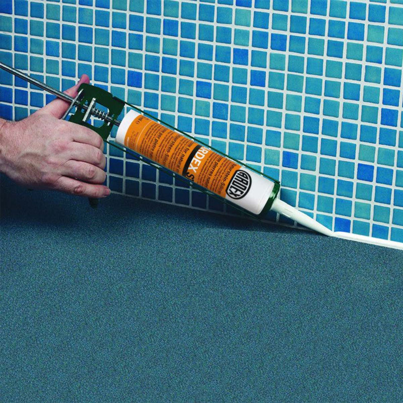 Man using tile sealant to seal tile grout