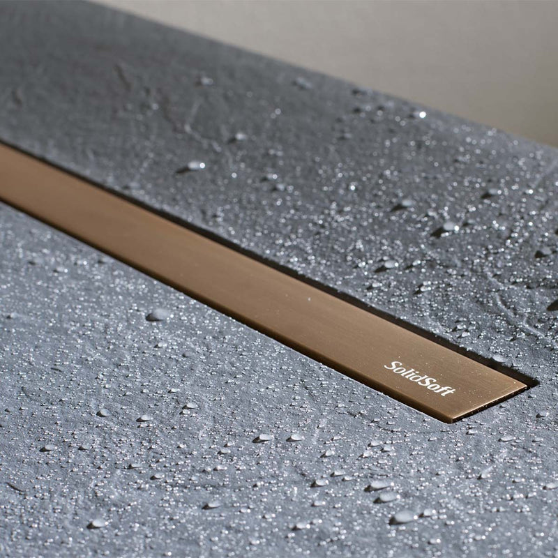 solidsoft soft slate flexible shower tray concrete linear drain copper close up